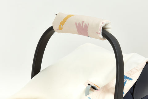 Armbeskytter babysæde Zoes dinosaur i beige